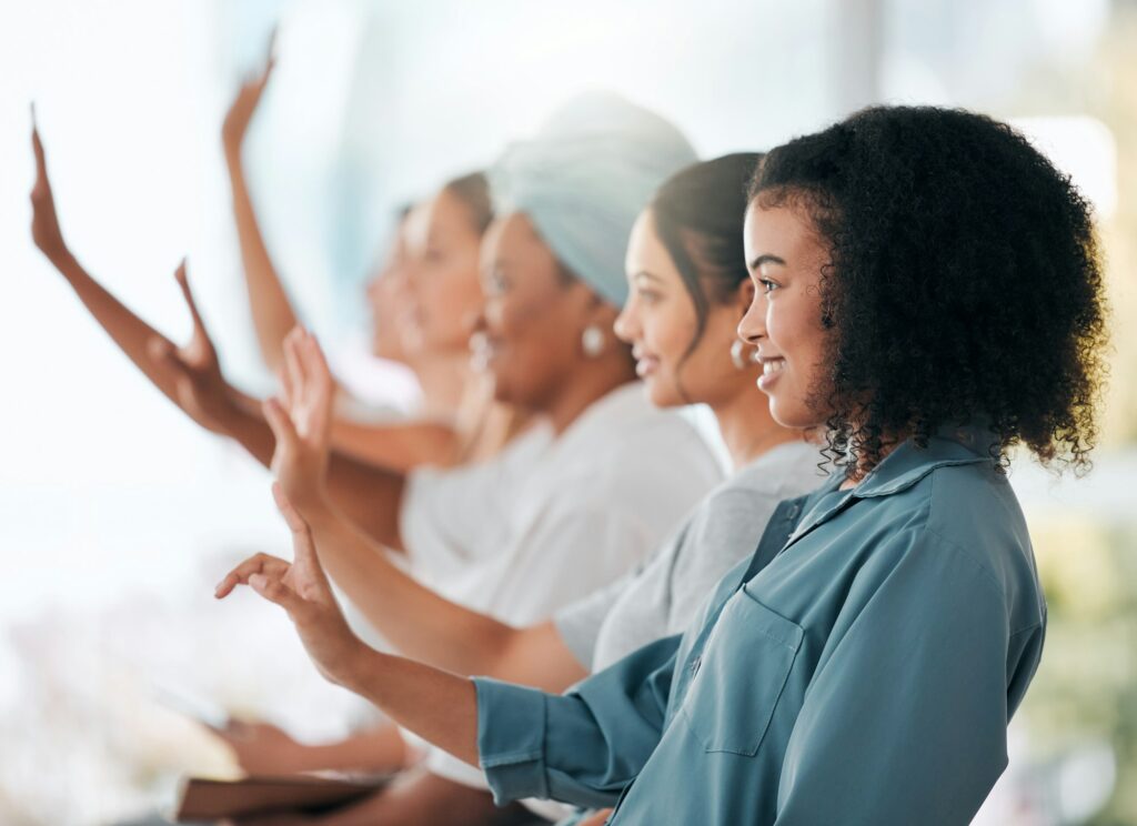 The Power of Colours in Relationship Feng Shui 2 Seminar, question and hands raised with business people in conference meeting for faq, training or