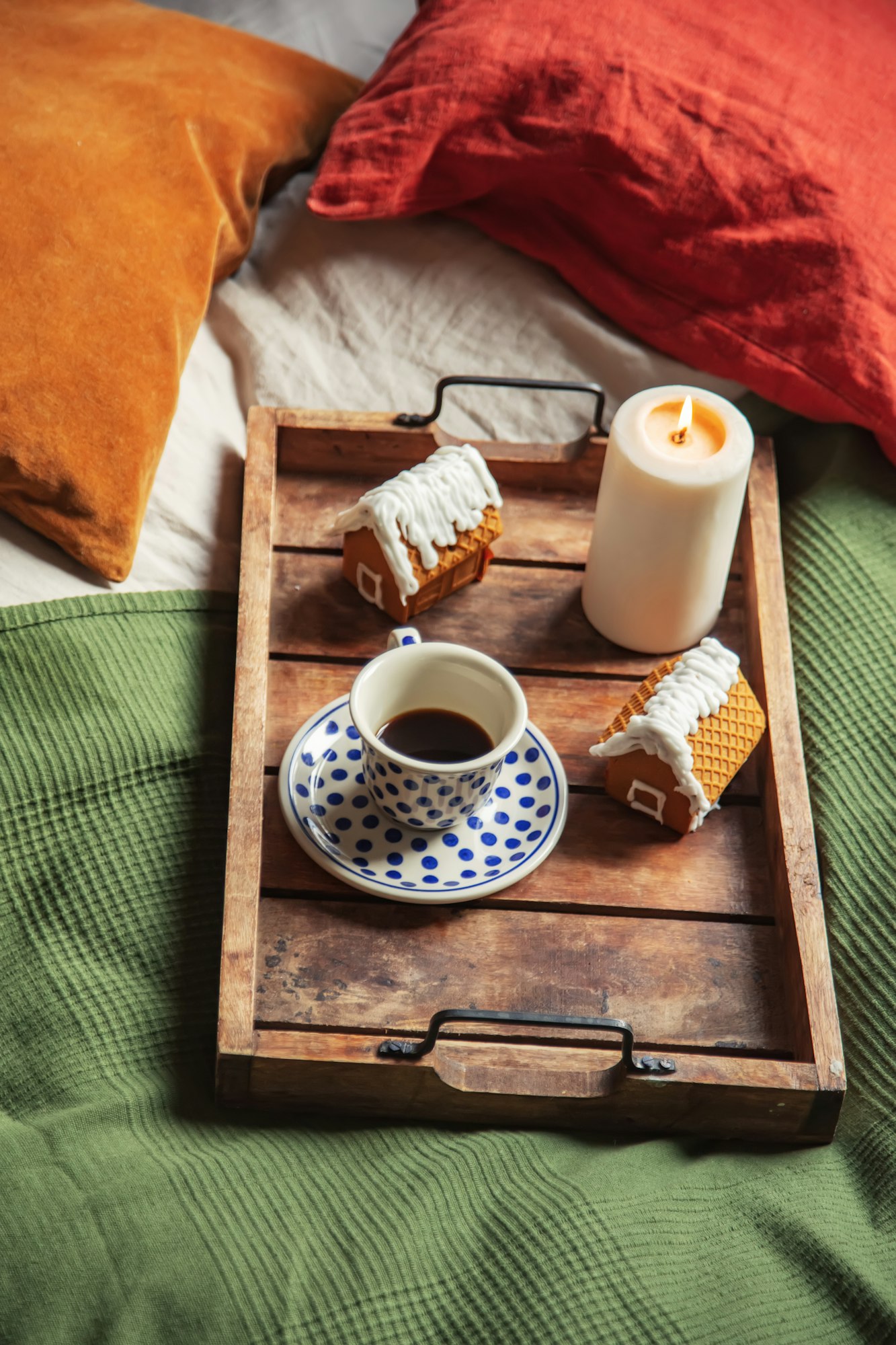Cup of coffee and Christmas cookies in a bed
